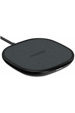 A Mophie Wireless 10W Universal Charging Pad on a white surface.