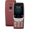 A Nokia 8210 4G red phone is shown next to a white background.