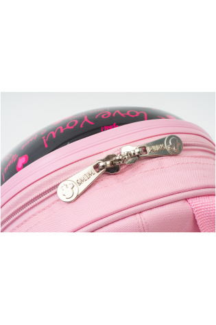 A close up of a pink KIDS LUGGAGE BAG with writing on it.